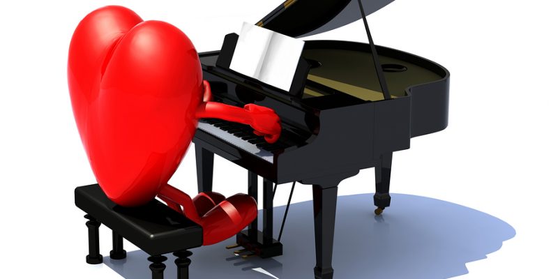 heart with arms and legs playing a piano love serenade concept.